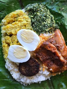 the meal is prepared and ready to be eaten on the leafy platter for consumption