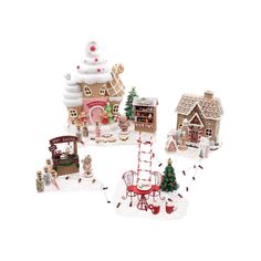 a group of miniature christmas houses with decorations on the front and side, all decorated in different styles