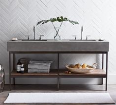 a bathroom with a sink, towel rack and rug on the floor in front of it