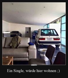 a living room filled with furniture next to a car