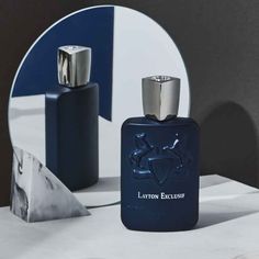 Layton Exclusif by Parfums de Marly is a unisex Amber fragrance launched in 2017, designed by perfumer Hamid Merati-Kashani. It has an aroma profile that is woody, oud, powdery, warm spicy, vanilla, animalic, citrus, almond, coffee, and sweet. Top Notes Bergamot, Grapefruit, Apple Heart Notes Geranium, Cinnamon, Lavender, Agarwood Base Notes Cypriol, Guaiac Wood, Patchouli, Vanilla From Parfums de Marly: "Generous, spirited and explosive, this Parfum asserts its strength and impetuousness. The striking new take on Layton is a deep, rich and woody fragrance for the connoisseur looking to make an impression. Top notes of bergamot, grapefruit and apple softly envelope the heart of cinnamon, lavender, agarwood and geranium. The base is concluded by guaiac wood, sensual vanilla and sweet cyprio French Elegance, Celebrity Perfume, Signature Fragrance