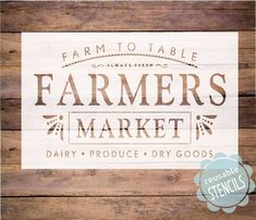 a wooden sign that says farmers market on it and the words farm to table written in white