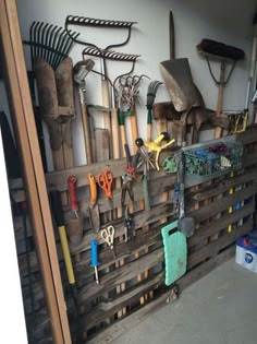 there are many tools hanging on the wall