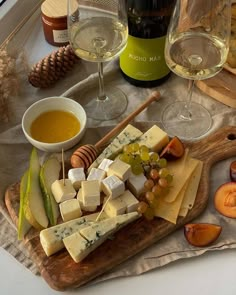 wine glasses and cheese on a table