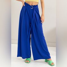 The Paperbag Waist Wide Leg Pants Are A Chic And Trendy Addition To Your Wardrobe. Featuring A Paperbag Waist Design, These Pants Are Flattering And Stylish. The Wide Leg Silhouette Offers A Comfortable And Breezy Fit For All-Day Wear. Pair Them With A Tucked-In Blouse Or Crop Top To Showcase The Unique Waist Detail. These Pants Are Perfect For Both Casual Outings And More Formal Events, Adding A Touch Of Sophistication To Any Outfit. Elevate Your Style With The Fashionable And Versatile Paperba Trendy Blue Belted Bottoms, Spring Blue Belted Bottoms, Blue Belted Summer Bottoms, Casual Blue Belted Bottoms, Casual Blue Wide Leg Pants With Belt Loops, Blue Paperbag Waist Bottoms For Spring, Versatile High Waist Blue Wide Leg Pants, Blue Paperbag Waist Bottoms With Belt Loops, Blue Wide Leg Pants With Pockets For Day Out