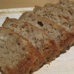 slices of banana bread sitting on top of a cutting board