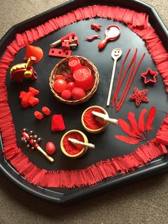 a black tray with red decorations on it