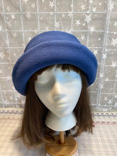 I made this beautiful fleece hat out of a dusty navy anti-pill fleece and lined it with a matching color fleece for warmth and body.  It's sized to fit most adults 22-23 inches around head.  The brim can be worn up or down.  It's a very comfortable fit on my 22 1/2 inch head.  Machine wash and dry, gentle cycle. A great travel hat for any season. Handmade in Oregon. Winter Blue Bucket Hat, Dusty Navy Blue, Travel Hat, Fleece Hat, Winter Hats For Women, Winter Hat, Winter Women, Color Matching, Caps Hats