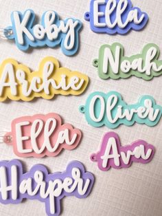 the name badges are all different colors and font options for hair clips or clippings