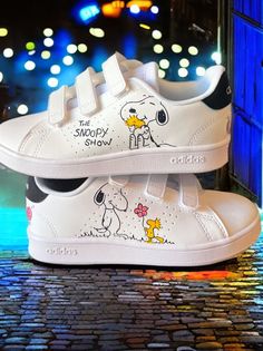 Custom sneakers with  Snoopy theme. ℹ️I can paint on any brand of shoes, contact me to inform you about the cost.  I use TOP quality paints and top coats, so that the sneakers will last for a long time! The paints are made to use for leather, so they are super durable! ☔️Don't worry when it's raining, the colors will still be great! You can buy these shoes for you, or for gift for someone you want...It's a unique design, don't you think? IMPORTANT ! RETURN POLICY: As the sneakers are tailor made White Low-top Sneakers With Cartoon Print, Sporty Low-top Sneakers With Cartoon Print, White Skate Shoes With Graphic Print And Round Toe, White Skate Shoes With Graphic Print, White Graphic Print Skate Shoes Round Toe, Snoopy Shoes, Custom Adidas, Sneakers Athletic, It's Raining