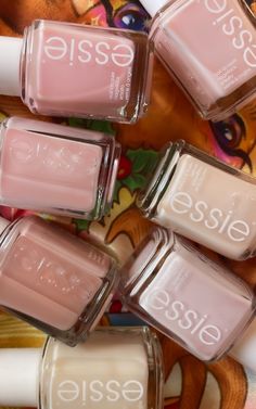 A complete review of seven popular nude and pink Essie sheer nail polish colors with swatches, from Ballet Slippers to Vanity Fairest and Allure! - - - - - essie vanity fairest swatch - essie allure swatch - essie limoscene swatch - essie mademoiselle swatch - essie not just a pretty face swatch - essie sugar daddy swatch - essie ballet slippers swatch - best sheer essie nail polish colors - sheer nail polish swatches - best drugstore nail polish brands - best essie nail polish colors - sheer pink nail polish - nude nail polish swatches - fall nail colors - winter nail colors - spring nail polish - summer nails ideas Teal Nail Polish