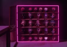 an illuminated shelf with many pop - up figures on it in front of a purple background