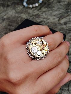 Adjustable steampunk ring made from a vintage swiss watch movement. Handmade. It looks very unusual on the finger. Ring size - adjustable Insert diameter - 19 мм (0,7 inch) I will ship the ring very quickly after purchase, as I am interested in you receiving your item as quickly as possible. Usually delivery takes 10-20 days, but there are delays. Please consider this before purchasing. If you have any questions, please write to me, I will be happy to answer you. There are many different vintage items in my store, please take a look, maybe you will find what you have been looking for for a long time. https://www.etsy.com/shop/ShopUSSRGoods?ref=seller-platform-mcnav Best regards, Maks Steampunk Rings, Style Steampunk, Vintage Watches Women, Swiss Watch, Steampunk Style, Steampunk Jewelry, Women Wrist Watch, Steampunk Fashion, Watch Gifts