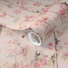 a close up of a flowered wallpaper with white and pink flowers on it