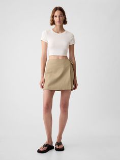 Soft linen-cotton blend wrap mini skirt.  Wrap-style tie at waist.  * Fit: Classic.  An A-line silhouette that's slim at the waist & easy through the hip with a flared opening.  Hits above the knee.  Note: Tyla is wearing a Gap Linen Skirt Outfit, Customized Clothes, Linen Mini Skirt, Skirt Aesthetic, Cotton Mini Skirt, Work Fits, Wrap Skirts, Tan Skirt, Khaki Skirt