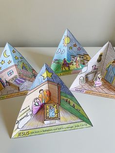 three paper pyramids depicting the birth of jesus