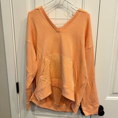 Brand New, Peach/Coral Sweatshirt. High Low Style Size Medium Comfortable Pink Tops For Spring, Oversized V-neck Sweatshirt For Spring, Oversized Pink Comfortable Sweatshirt, Oversized Pink V-neck Top, Oversized V-neck Sweatshirt Casual, Oversized V-neck Sweatshirt Casual Style, Casual Oversized V-neck Sweatshirt, Pink Casual Sweatshirt For Summer, Casual Pink Sweatshirt For Loungewear