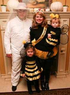 a family dressed up in costumes for halloween