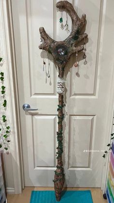 a door way with a tree branch decoration on it