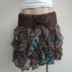 Wet Seal * Missoni Ruffle * Print * Skirt Size Large New With Tags. 100% Polyester Measurements(Laying Flat): Waist: 14.5+"(Stretchy) Top To Bottom(Entire Length): 16" Thank You For Looking Brown Ruffled Skirted Bottoms, Brown Ruffled Skirt Bottoms, Brown Skirted Bottoms With Ruffled Detail, Brown Skirted Bottoms With Ruffled Skirt, Brown Ruffled Skirt For Spring, Fitted Brown Bottoms With Ruffles, Fitted Bohemian Brown Mini Skirt, Chic Brown Ruffled Bottoms, Bohemian Brown Bottoms With Ruffles