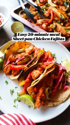 two tacos are sitting on a plate with lime wedges next to them and the words easy 20 minute meal sheet pan chicken fajitas