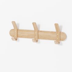 a wooden coat rack with two hooks on it