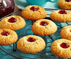 cookies with jam are on a cooling rack