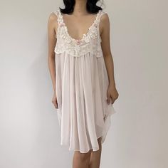 Measurements: Bust: Up to 38" Length: 41" Brand: Wisteria by Diane Samandi Label: Medium -- Best fits sizes M-L. Condition: Used - Excellent Material: Polyester Model is 5' 6" and wears the size XS (cup size: 30A, bust 30", waist 26", hips 37"). * Express shipping, please inform your phone number via message or note. Returns, exchanges, and refunds are not accepted. Please read measurements in each product page carefully before purchasing to ensure the item fits. If you have any questions about specific clothing please contact us at message before placing an order. Sheer Nightgown For Wedding Night In Spring, Sheer Summer Nightgown For Wedding Night, Sheer Nightgown For Wedding Night In Summer, Feminine Spring Chemise For Wedding Night, Feminine Chemise For Wedding Night In Spring, Sheer Nightgown For Beach In Spring, Sheer Nightgown For Beach Spring Season, Flowy Nightgown For Wedding Night, Sheer Sleeveless Chemise For Spring