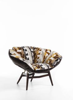 an upholstered chair with geometric patterns on it