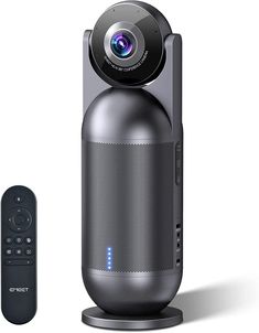 an image of a camera next to a remote control for the home theater projector