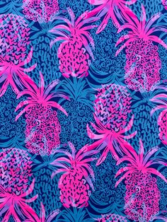 pink and blue pineapples are on a blue background