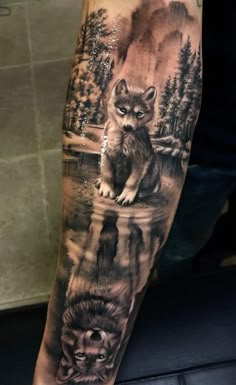 a man's arm with an animal tattoo on it, and the image of two wolf