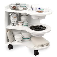 a white shelf with various items on it