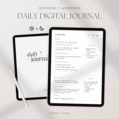 the daily journal is next to a tablet with a pen and paper on top of it