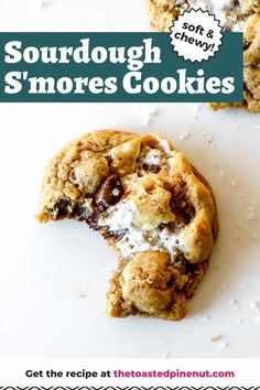 a close up of a cookie with the words sourdough s'mores cookies