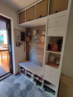 a room with some shelves and shoes on the floor