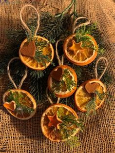 orange slices are arranged in the shape of hearts on a burlocked tablecloth