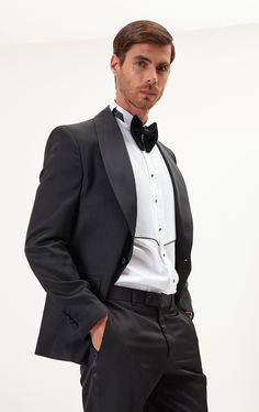 DETAILS If you find your evening event calendar filling up fast, it might be time to boost your black tie attire with a luxurious dinner jacket, like our classic black style. Made from a textured lustrous fabric with tactile irregularities on the surface, it's tailored with elegant shawl lapels and fastens with covered buttons for a streamlined finish. The full lining reinforces the fine cloth and means it'll layer smoothly over your shirt. The suit consists of a tuxedo jacket and a pair of pant Luxurious Dinner, Shawl Lapel Tuxedo, Black Tie Attire, Elegant Shawl, Dinner Jacket, Tuxedo Jacket, Twill Weave, Style Noir, Event Calendar