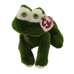 a green stuffed animal with big eyes and a tag on it's ear