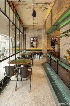 the inside of a restaurant with tables and chairs