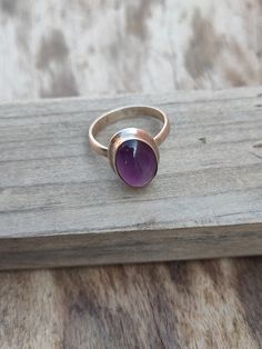 NOTE : WE USED NATURAL GEMSTONES , SO STONE MAY BE LITTLE DIFFERENT .This is a listing of Boho sterling silver ring # metal = sterling silver 925 # Gemstone - Amethyst # Ring Size - Available in all Size # Stone Color - Purple # Stone Shape - Oval Handmade Crafting bohemian Ring - This style has bohemian style . it will look beautiful when you wear it .. Thanks for visiting our shop ... favorite our shop for daily updates ... Bohemian Stackable Gemstone Rings Oval Shape, Bohemian Silver Amethyst Ring, Bohemian Amethyst Ring Gift, Handmade Bohemian Oval Ruby Ring, Bohemian Handmade Oval Ruby Ring, Bohemian Sterling Silver Purple Rings, Adjustable Bohemian Amethyst Ring In Sterling Silver, Handmade Bohemian Amethyst Ring In Sterling Silver, Adjustable Bohemian Amethyst Ring For Gifts