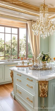 a fancy kitchen with an island and chandelier