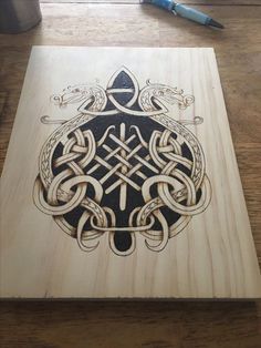 a wooden box with an intricate design on it