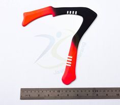 an orange and black handle on a ruler