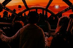 two people looking out at the sunset from inside a space station with an orange sky in the background