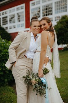 a bride and groom posing for a photo in front of a house