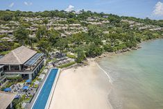 an aerial view of the resort and beach