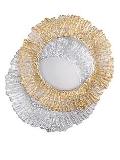 a white plate with gold trimmings and a mirror on the top of it