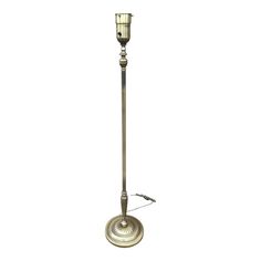 a tall metal pole with a light on top