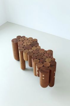 several pieces of wood stacked on top of each other in the shape of circles and dots